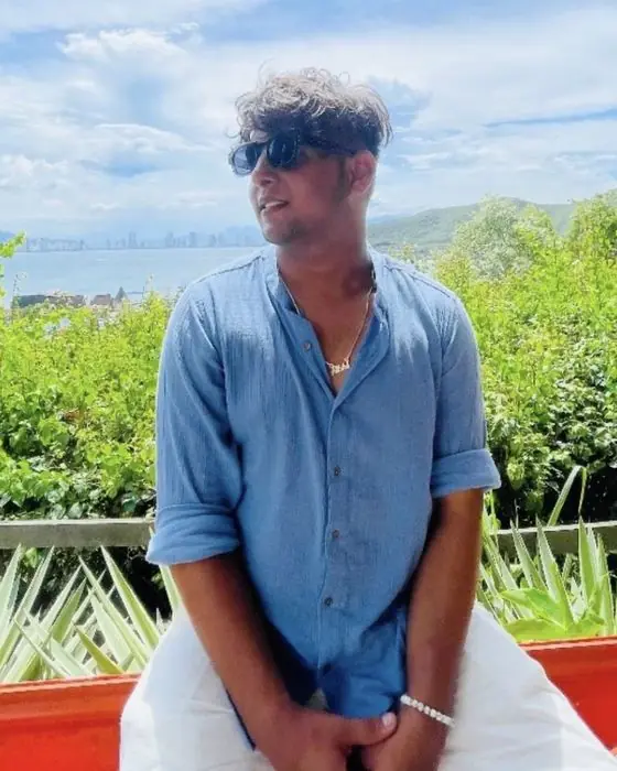 Abhijay smiling, overlooking a bay